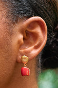 Alaké bold statement drop earrings featuring intricately carved Mediterranean coral drops and premium precious gemstone accents.