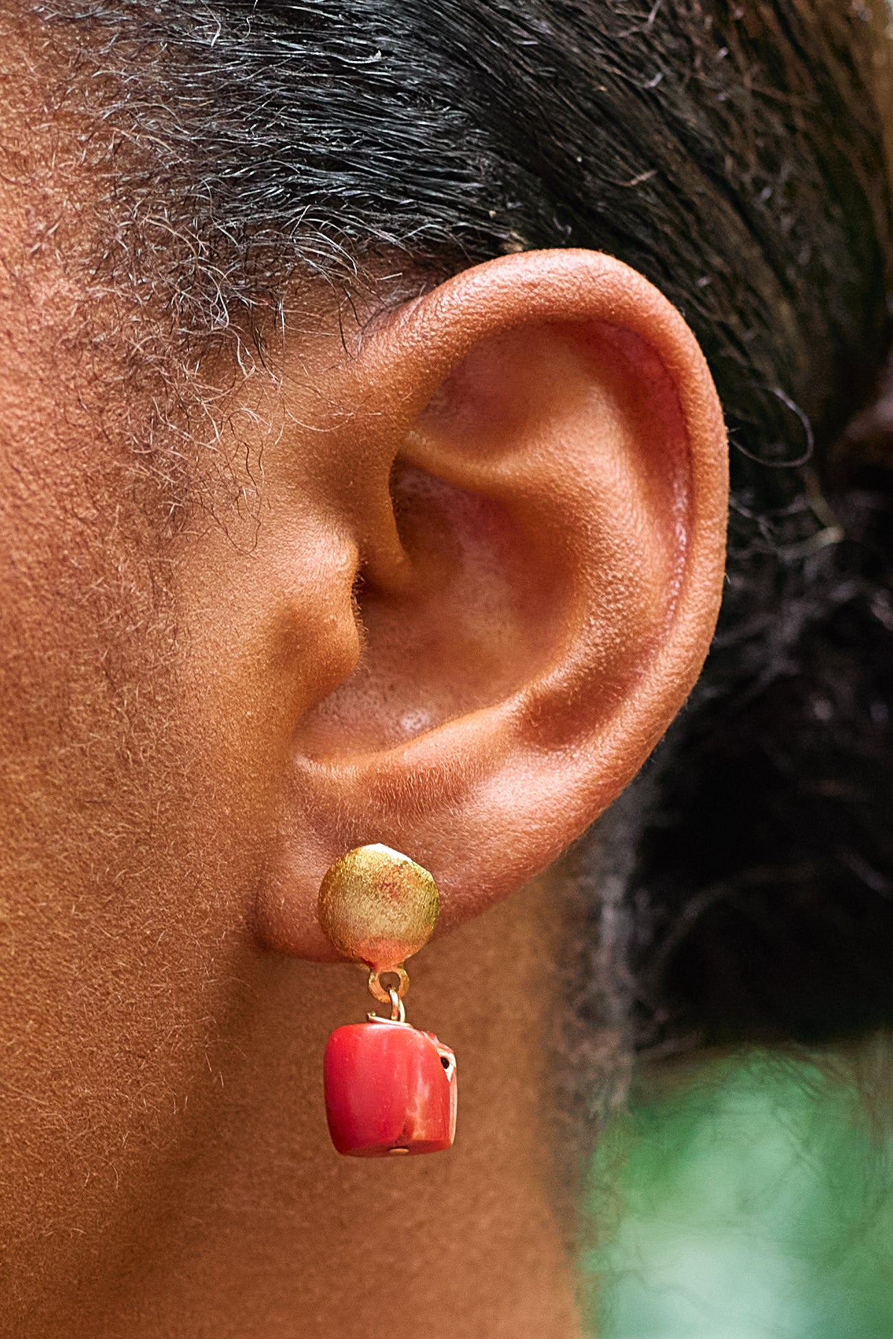 Alaké bold statement drop earrings featuring intricately carved Mediterranean coral drops and premium precious gemstone accents.