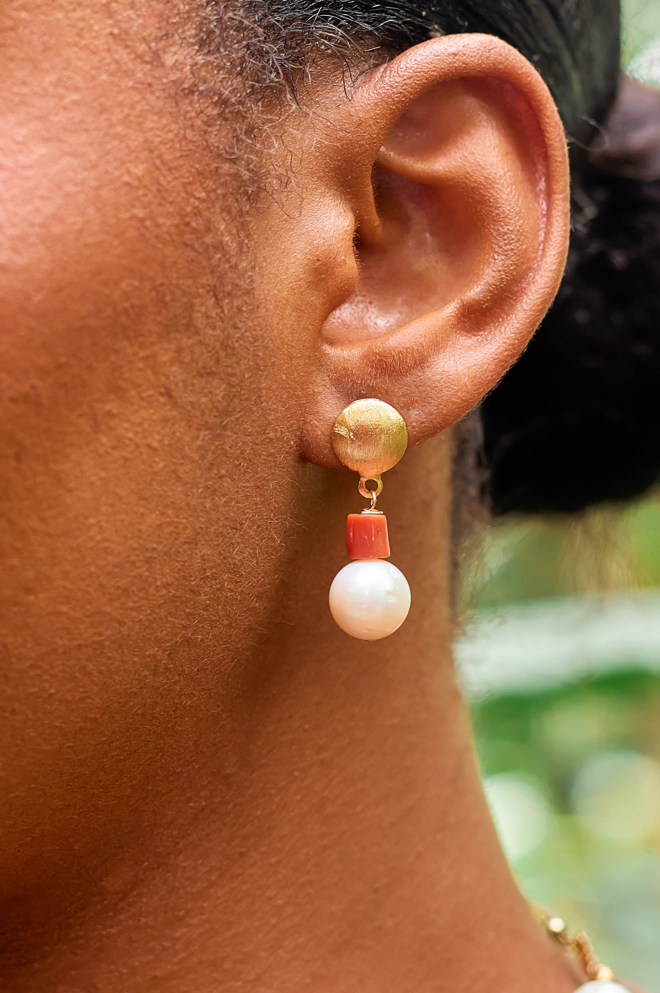 Àyoká authentic Mediterranean coral and cultured freshwater pearl stud earrings. Handcrafted luxury jewelry by Jewellery Banc.