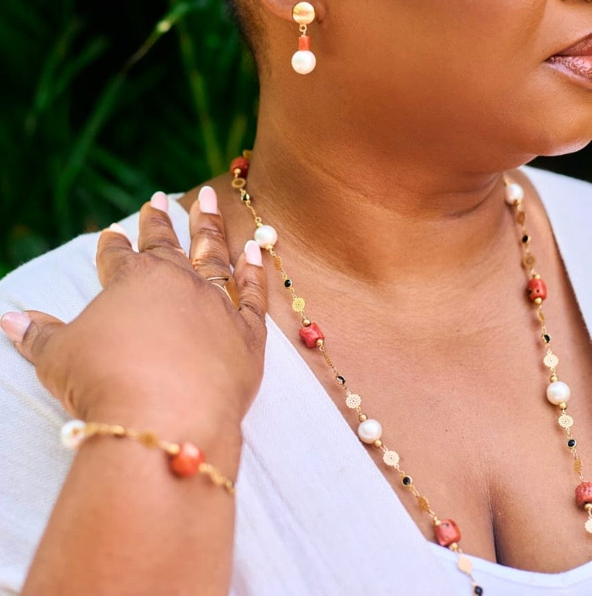 Àyọkà Kìnì luxury Mediterranean coral bead and freshwater pearl necklace, bracelet, and earring bridal set by Jewellery Banc.