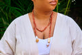 Omoluabi VI bespoke pendant necklace featuring a handcarved authentic antique Mediterranean coral medallion by Jewellery Banc.